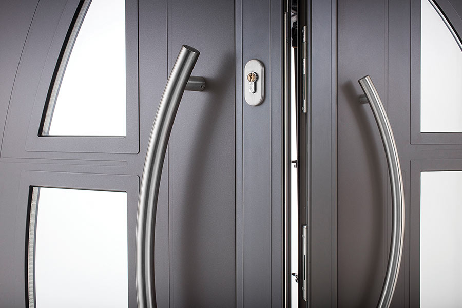 Aluminium door with curved chrome handles